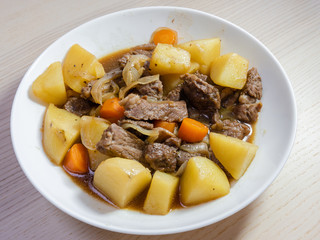 Close-up view of beef and potato stew.