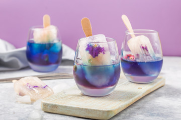 Cool herbal summer drink, Butterfly pea and lemongrass juice added. A beautiful color and tasty beverage cocktail.