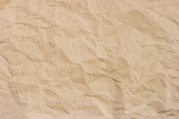 Brown crumpled paper texture background with space for design.