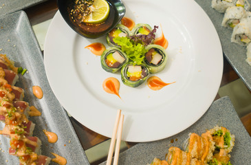 delicate assorted Japanese sushi rolls on beautiful set up on table in traditional healthy Asian food and creative oriental dining - Japan gourmet cuisine tasting menu