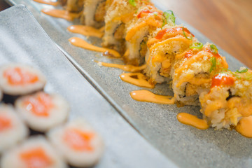 delicious assorted Japanese sushi rolls on beautiful set up on table in traditional healthy Asian food and creative oriental dining - Japan gourmet cuisine tasting menu