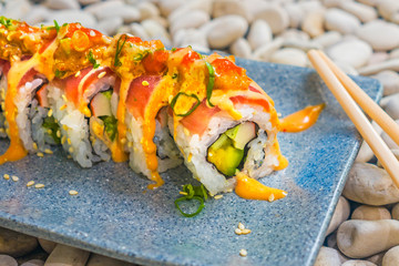 Japan gourmet cuisine -  delicious and delicate dish of Japanese sushi rolls in slate on stone background in traditional healthy Asian food and creative oriental dining