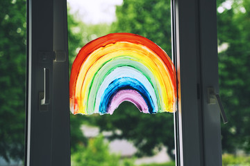 Close-up photo of painting rainbow on window