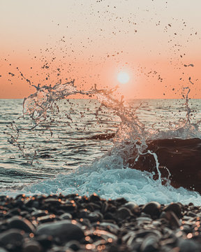 water splashes at sunset