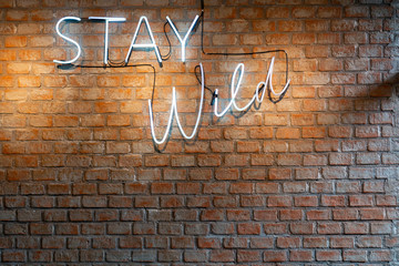 Light with words on an old brick walls.