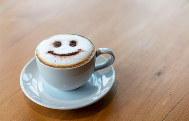 Cappuccino is an espresso-based coffee drink. Latte art at cafe. White Cup of art latte on a...