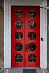 old red door. Architecture of European city. Retro building exterior. Doorway of house facade.