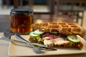 Brussels waffles with ham and salad.