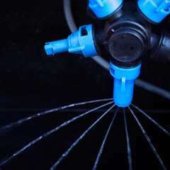 The nozzle of the watering machine sprays water.