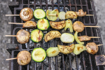 Fototapeta premium Vegetable skewers grilling on the barbecue
