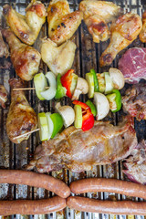 Chicken and pork meat on the barbecue