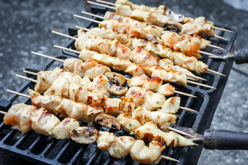 Chicken meat and champignon mushrooms skewers