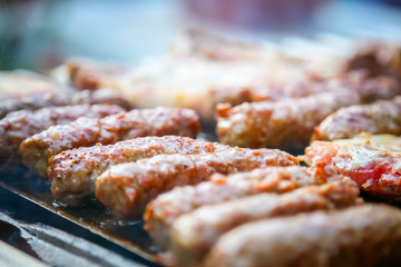 Meatballs with pork meat on the barbecue