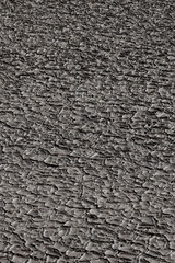 Dry soil cracking, Dry land. Cracked ground background..Cracks of soil, white and black surfaces for texture and background.