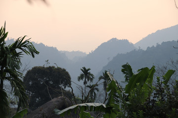 Fototapeta na wymiar Silhouettes of the mountains in the light of dawn in Ha giang, Vietnam