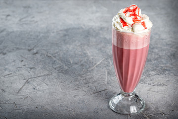 Cherry Milkshake in a transparent, tall, glass glass