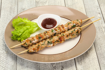 Minced pork skewer kebab with sauce