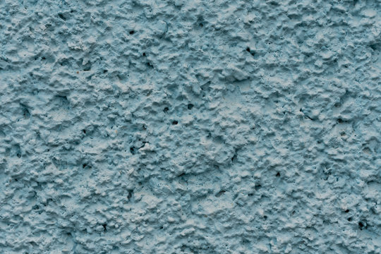 texture of blue stucco wall with tubercles