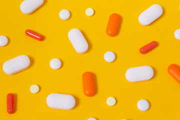 Vitamins for energy yellow background. Close up.