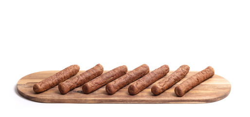 Wooden tray with frikadellen, a Dutch fast food snack, isolated