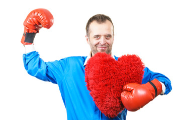 Man with boxing gloves holding heart