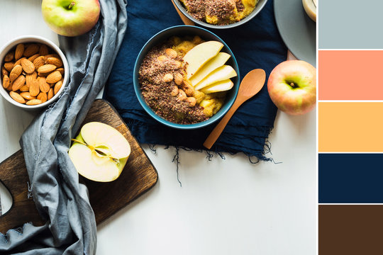 Cozy morning concept with turmeric amaranth porridge served with apples, flax seeds and almonds. Healthy plant based vegan breakfast. Flat lay Color swatch