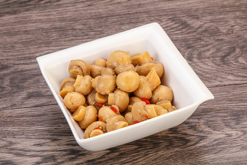 Pickled champignons in the bowl