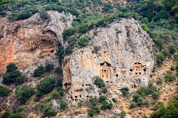 Ancient lycian Myra rock tomb ruins in Demre, Antalya.