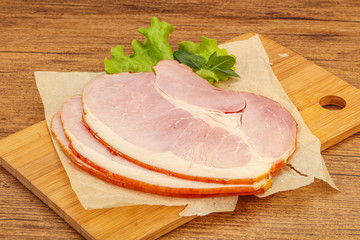 Sliced pork belly over board