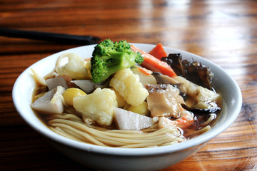 Chinese vegetarian noodle served by Buddhist Jiming temple in Nanjing China, some food in the bowl are made by tofu. Eat vegetarian food is Chinese tradition for people pray in the temple