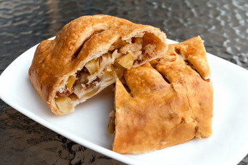 Apple strudel cut, cafe bakery concept.