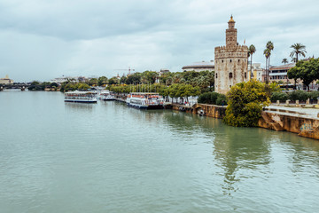 Fototapeta na wymiar Guadalquivir River and Torre del Oro in Seville, Spain.