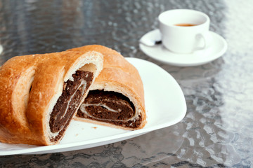 Poppy strudel cut, cafe bakery concept.
