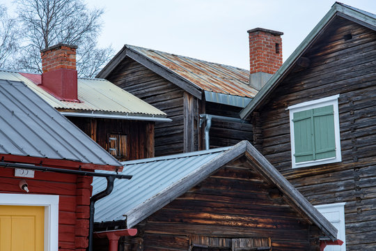 Facade and rooftops of small wooden buildings, residents to people visiting the church on Sundays. Ojeby church town outside of Pitea, Sweden.  