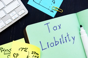 Financial concept about Tax Liability with sign on the page.