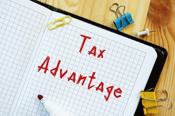 Financial concept meaning Tax advantage with sign on the piece of paper.