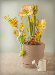 Blooming hippeastrum (amaryllis) and a figurine of a rabbit  (mass production)