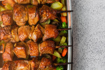 Appetizing, juicy turkey skewers on wooden skewers. Home cooking. Family dinner option. Homemade food.