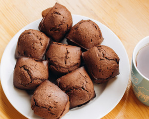 Сhocolate cupcakes on a white plate prepared at home
