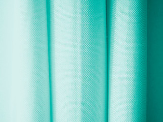 Textured blue fabric with pronounced lines. Background for the text.