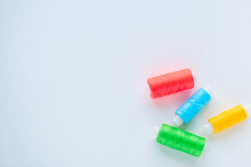 Accessories for sewing. Colored spools of thread