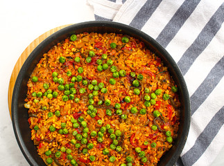 Vegan Paella with red peppers and green beans. 