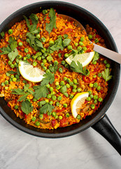 Vegan Paella with red peppers and green beans. 