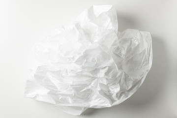 Squeeze a crumpled foam sheet isolated on white background with copy space.