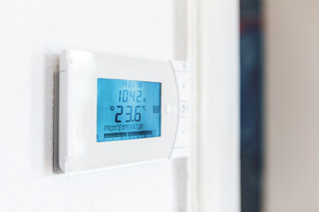 climate control panel on the wall in a room in a residential building. HVAC and electronic smart...