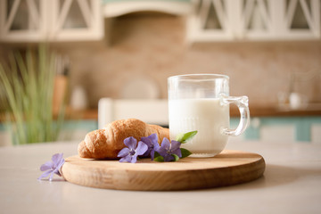 glass of milk and croissant