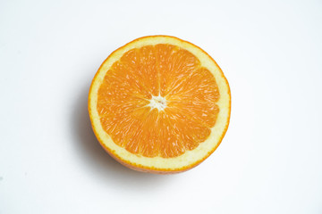 Half the cut oranges on a white background