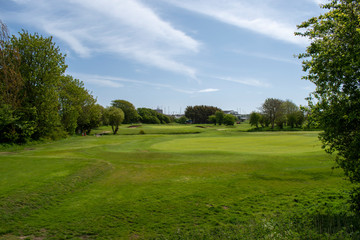 Obraz na płótnie Canvas View from the tee on hole 16, a pretty par 3 at Littlehampton links golf course.