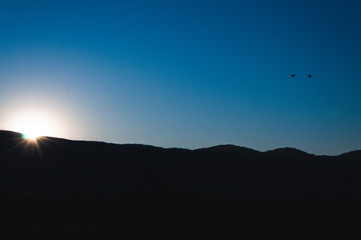 Sunrise behind a mountain top