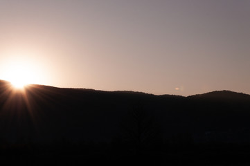 Sunrise behind a mountain top